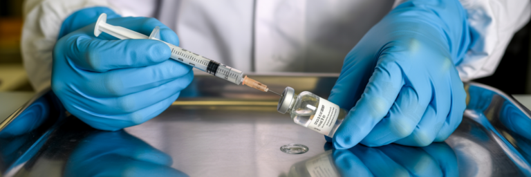Drawing bacteriostatic water with syringe.